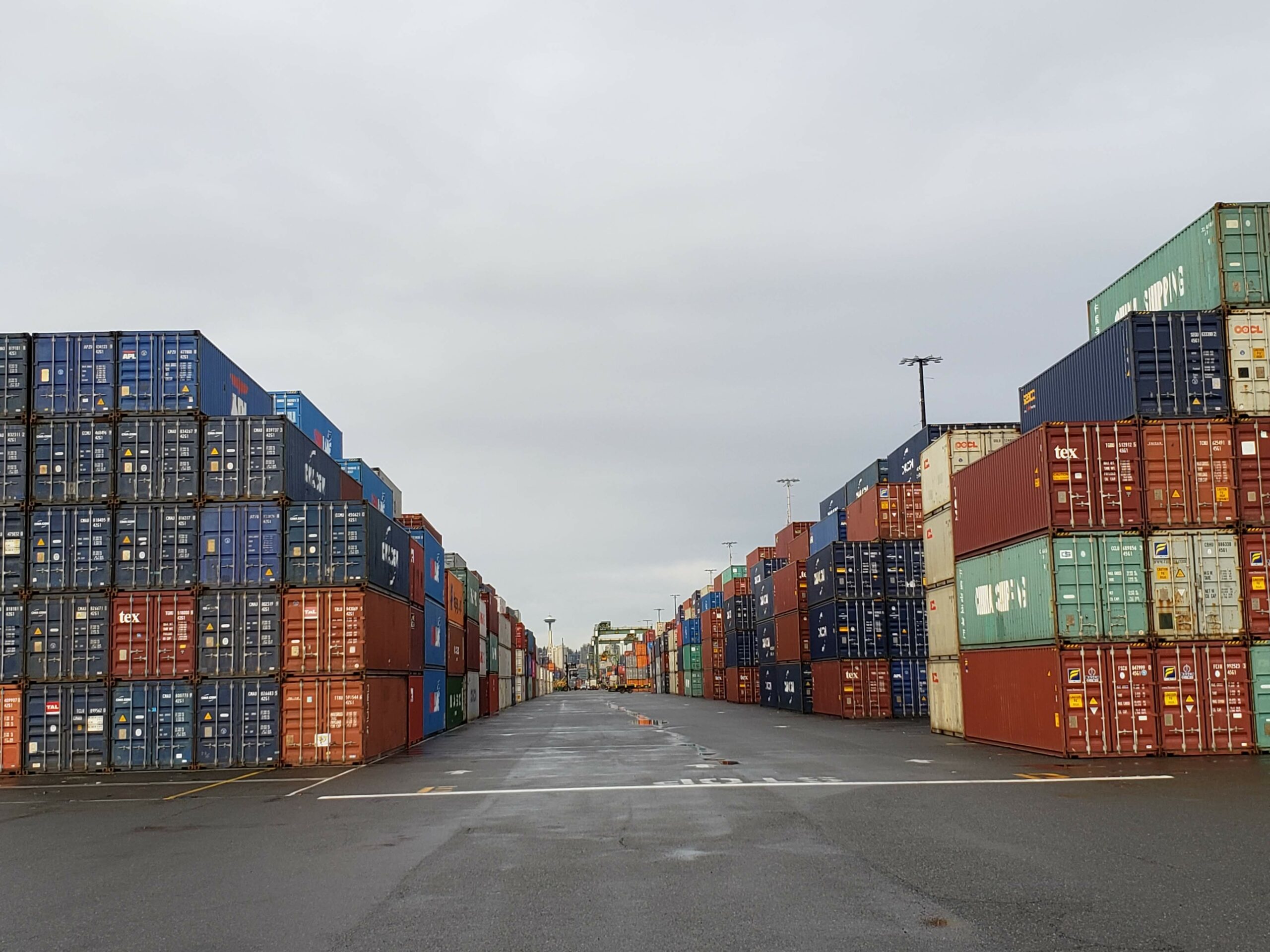 an aisle between shipping containers in the Port of Seattle