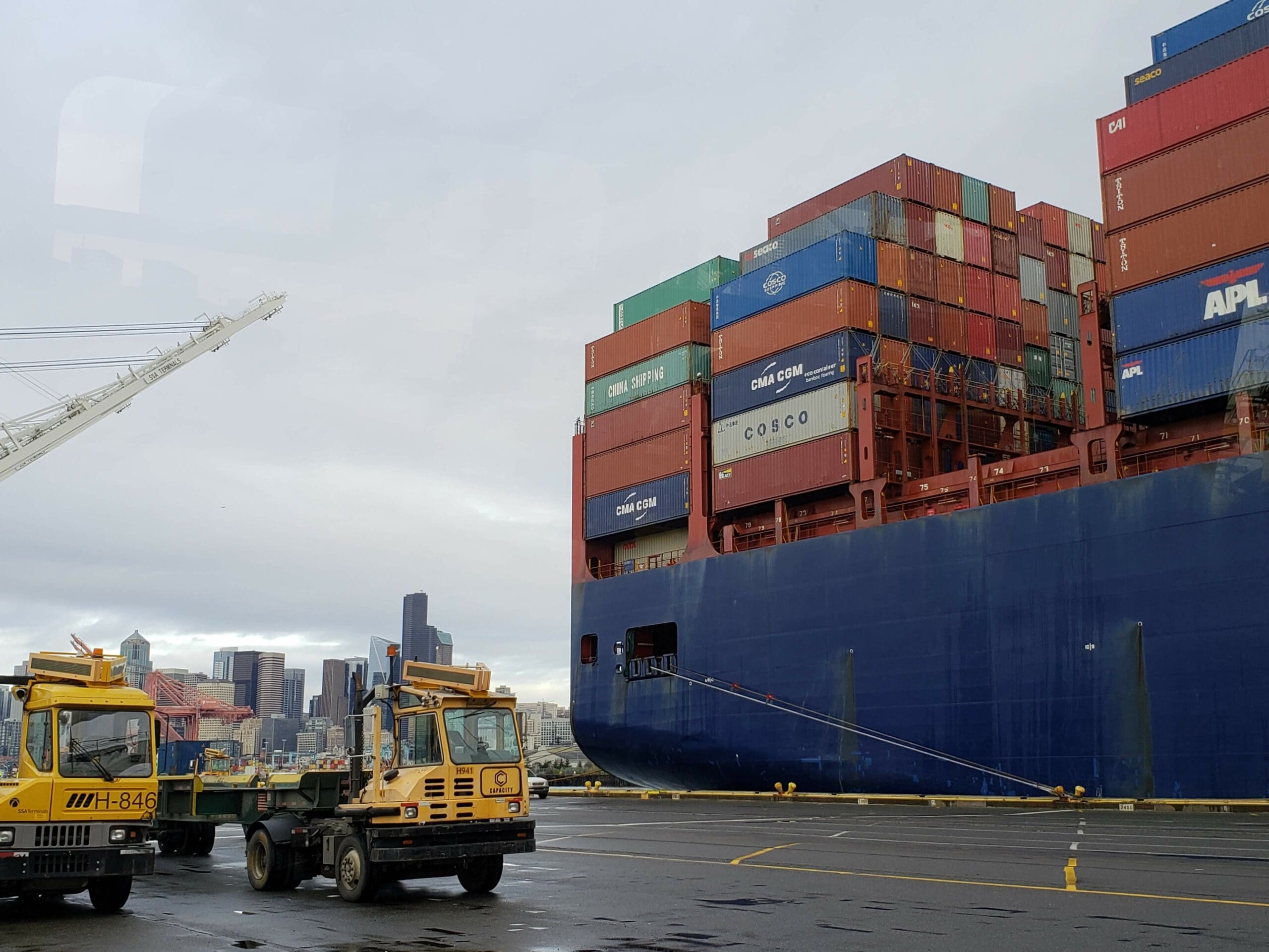 stacks of shipping containers in the port of Seattle